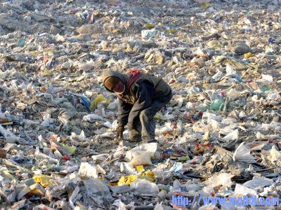 an-impoverished-mongolian-man-sorts-through-garbage-at-an-ulan-bator-dump.jpg